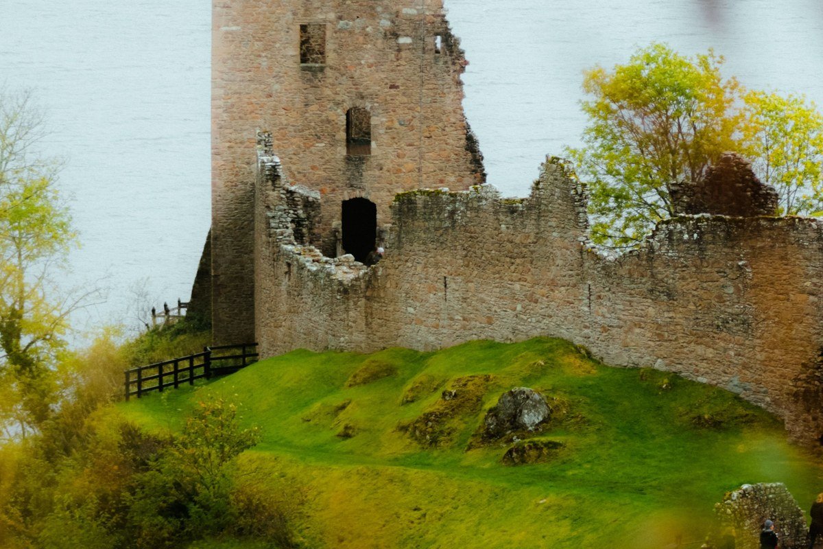 Kilchurn Castle Loch Awe Scotland mist ruins at sunrise reflected in water