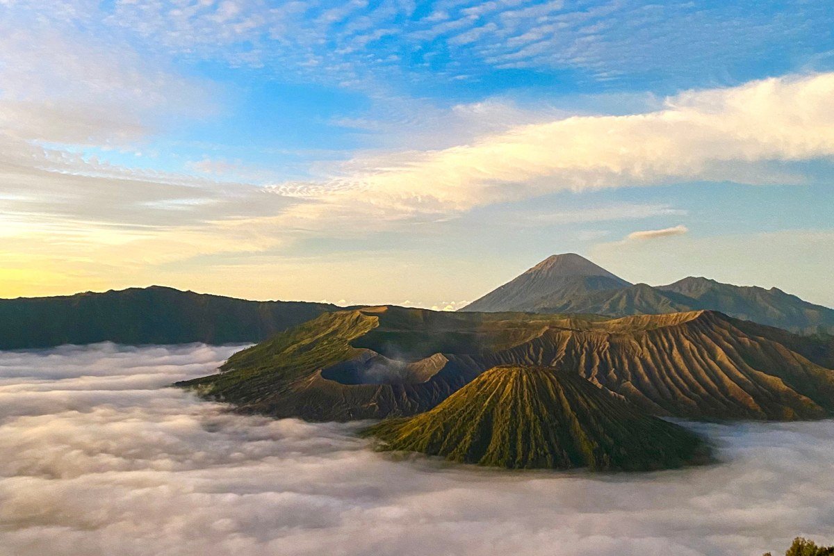Kawah Ijen volcano Java Indonesia blue fire sulfur lake crater mist at dawn
