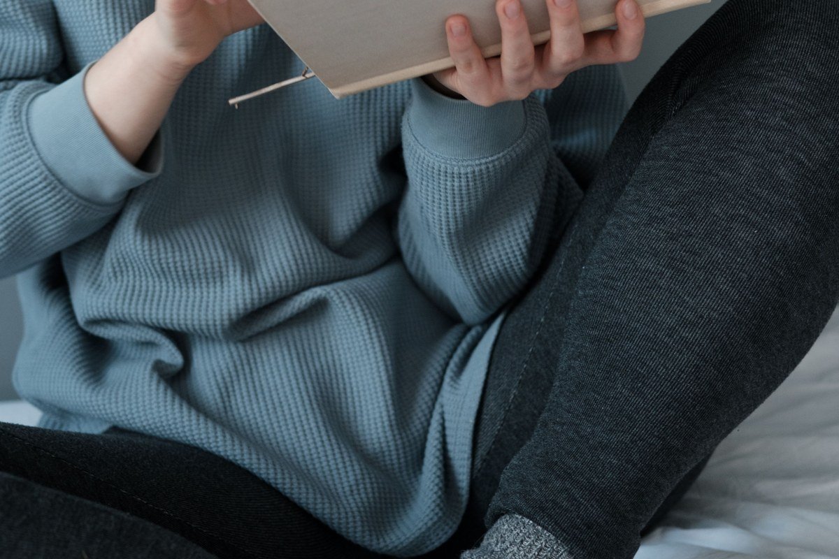 cozy knit socks leggings oversized cardigan reading nook cabin lake view