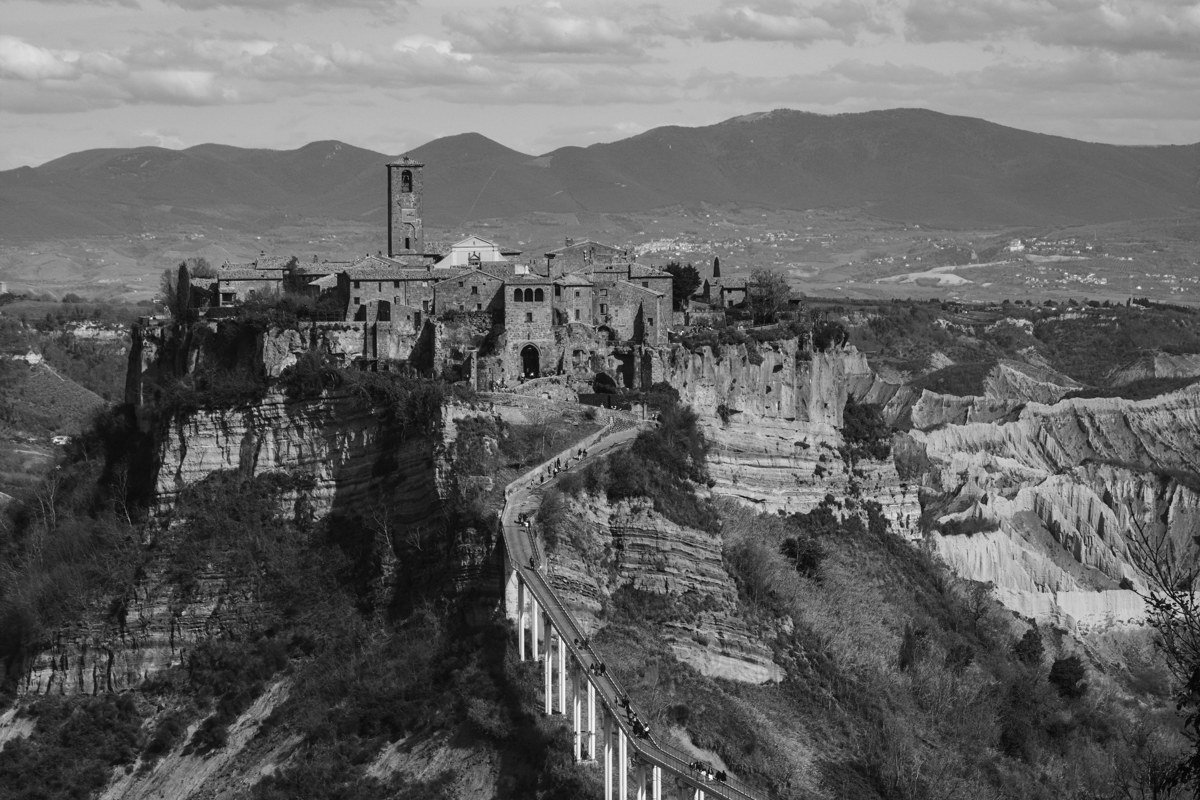 Civita di Bagnoregio Italy hilltop village eroding tufa cliffs pedestrian bridge