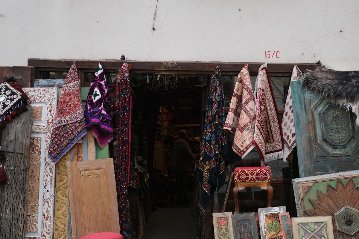 Kruje Albania bazaar cobblestone lane Ottoman wooden shops mountain backdrop