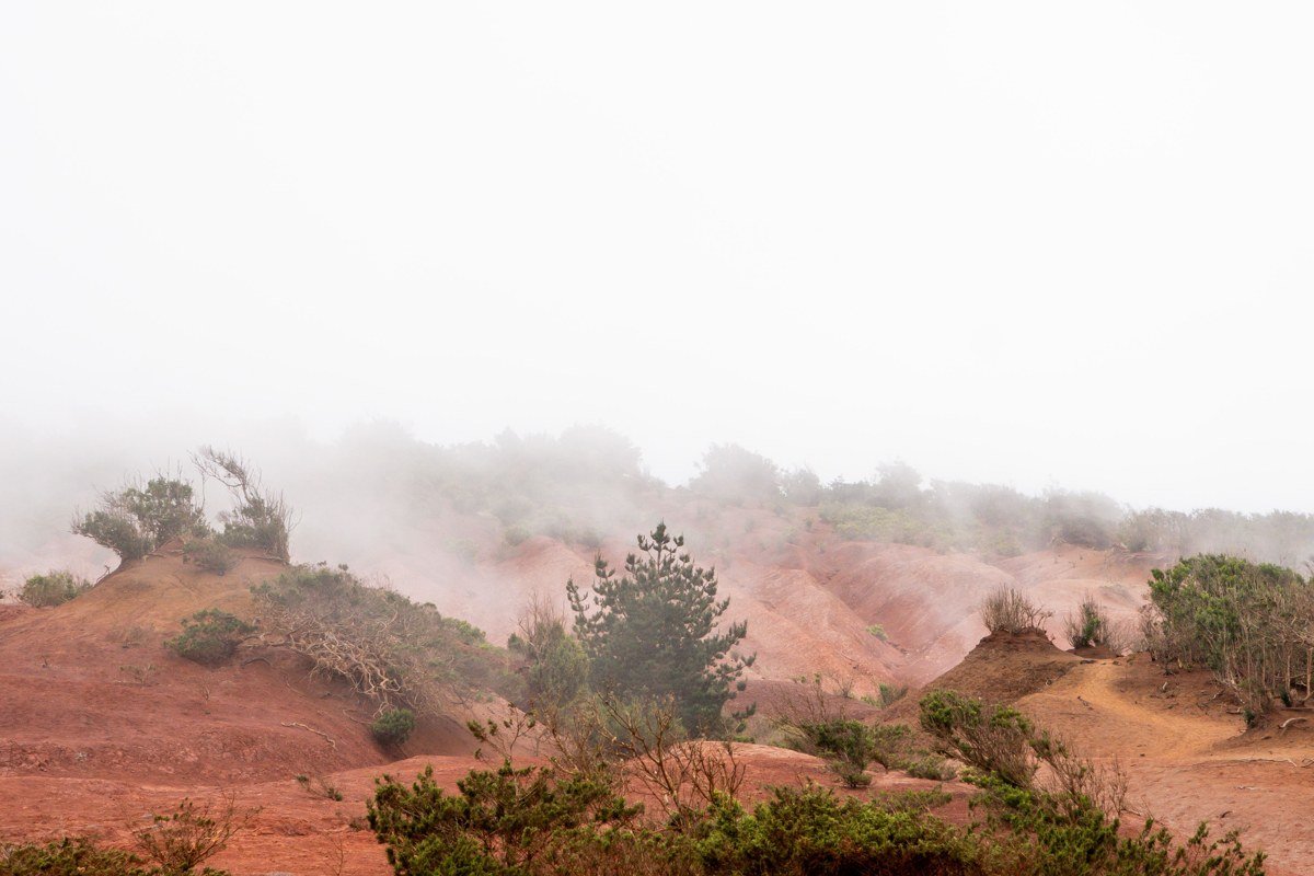 surreal dramatic landscape wide shot volcanic terrain fog moody twilight