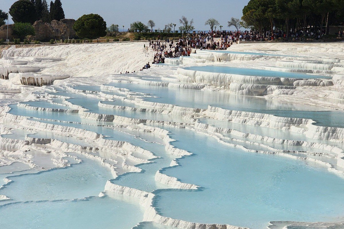 Pamukkale Turkey white calcium travertine terraces turquoise pools sunset