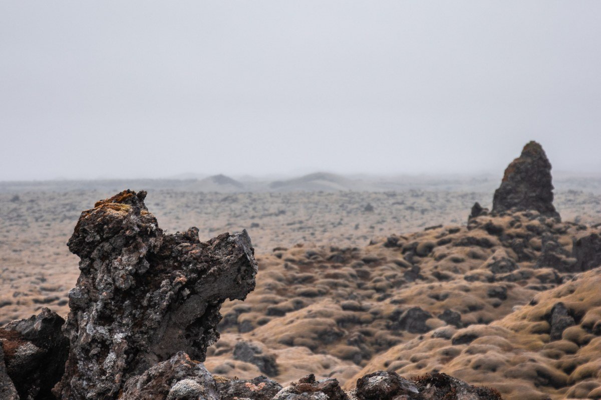Iceland dramatic volcanic landscape moody sky lava field and mountain