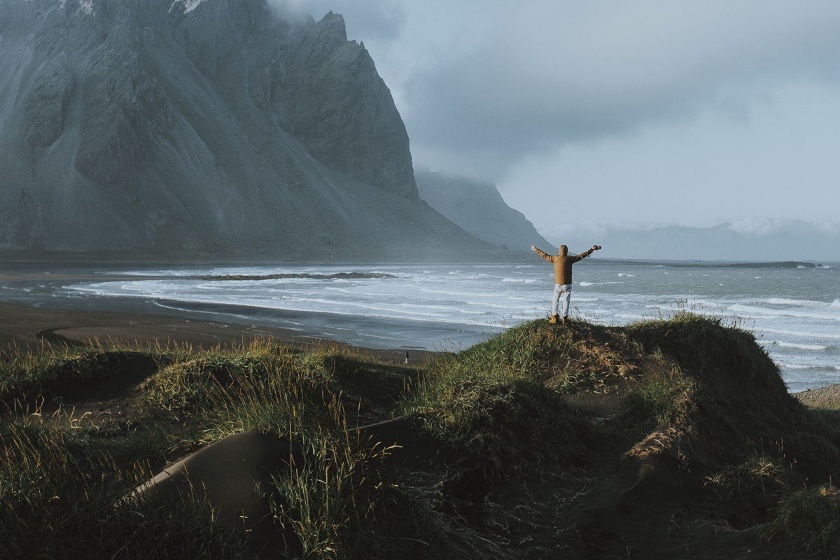 Vestrahorn mountain Iceland black sand beach dramatic reflections moody sky