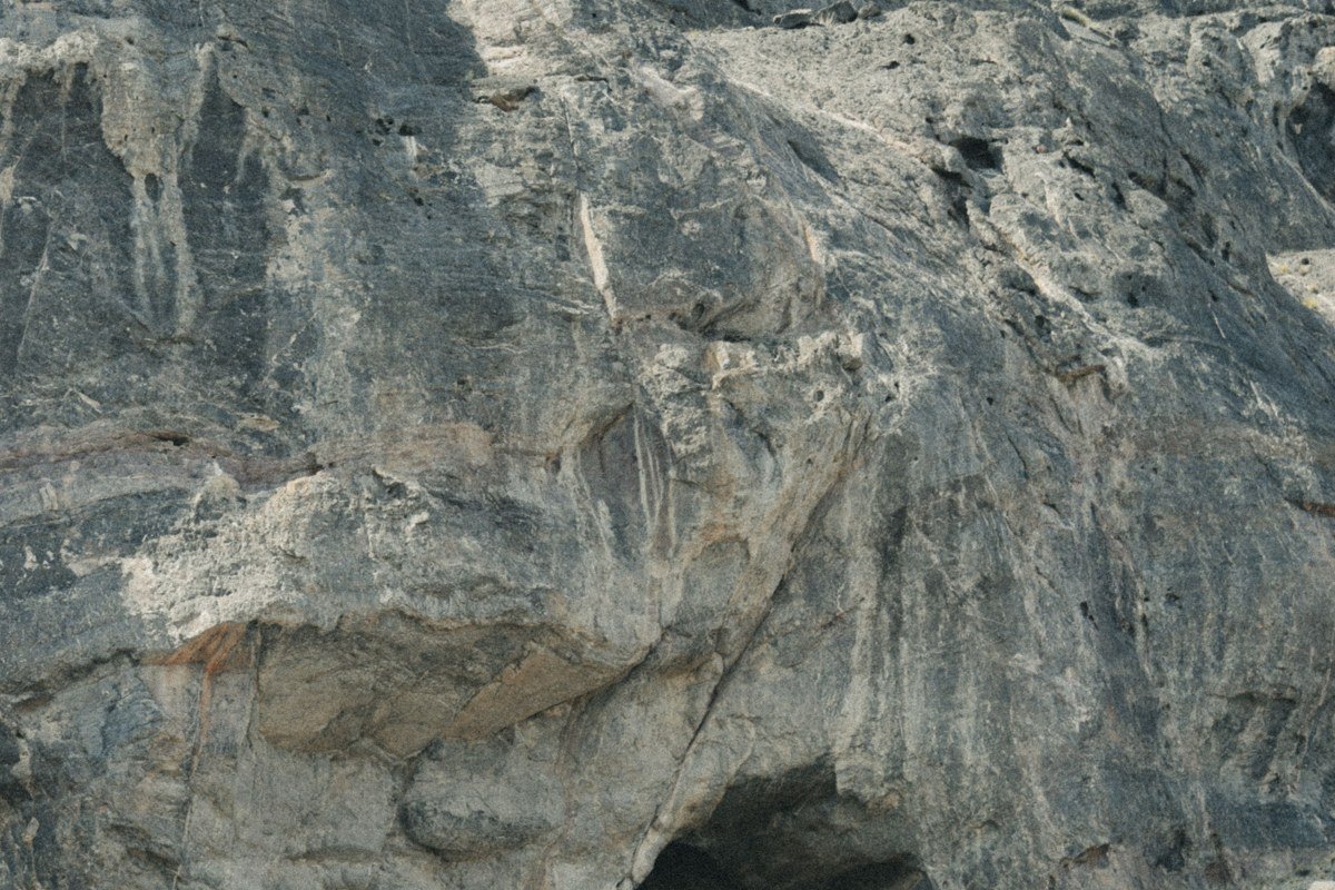 Cueva Milodon Chile giant cave mouth basalt cliffs Patagonian steppe light