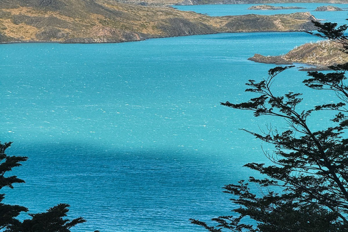 Cuernos del Paine Chile granite horns reflection Lago Nordenskjold stormy clouds