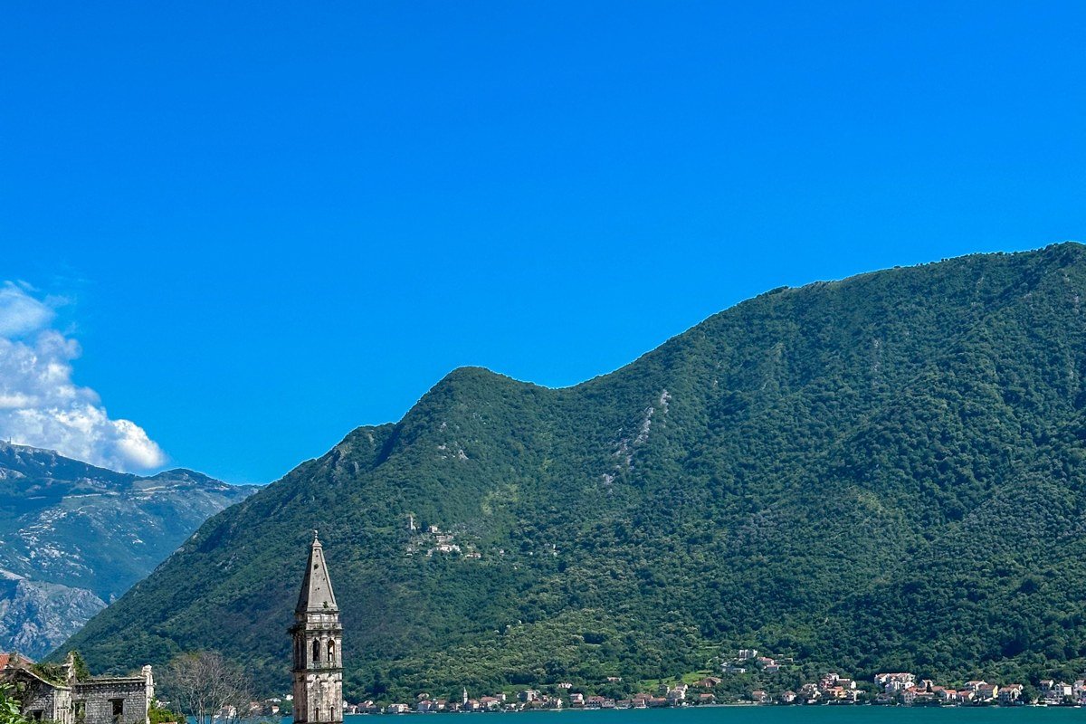 Kotor Montenegro old town fortification walls misty bay mountains