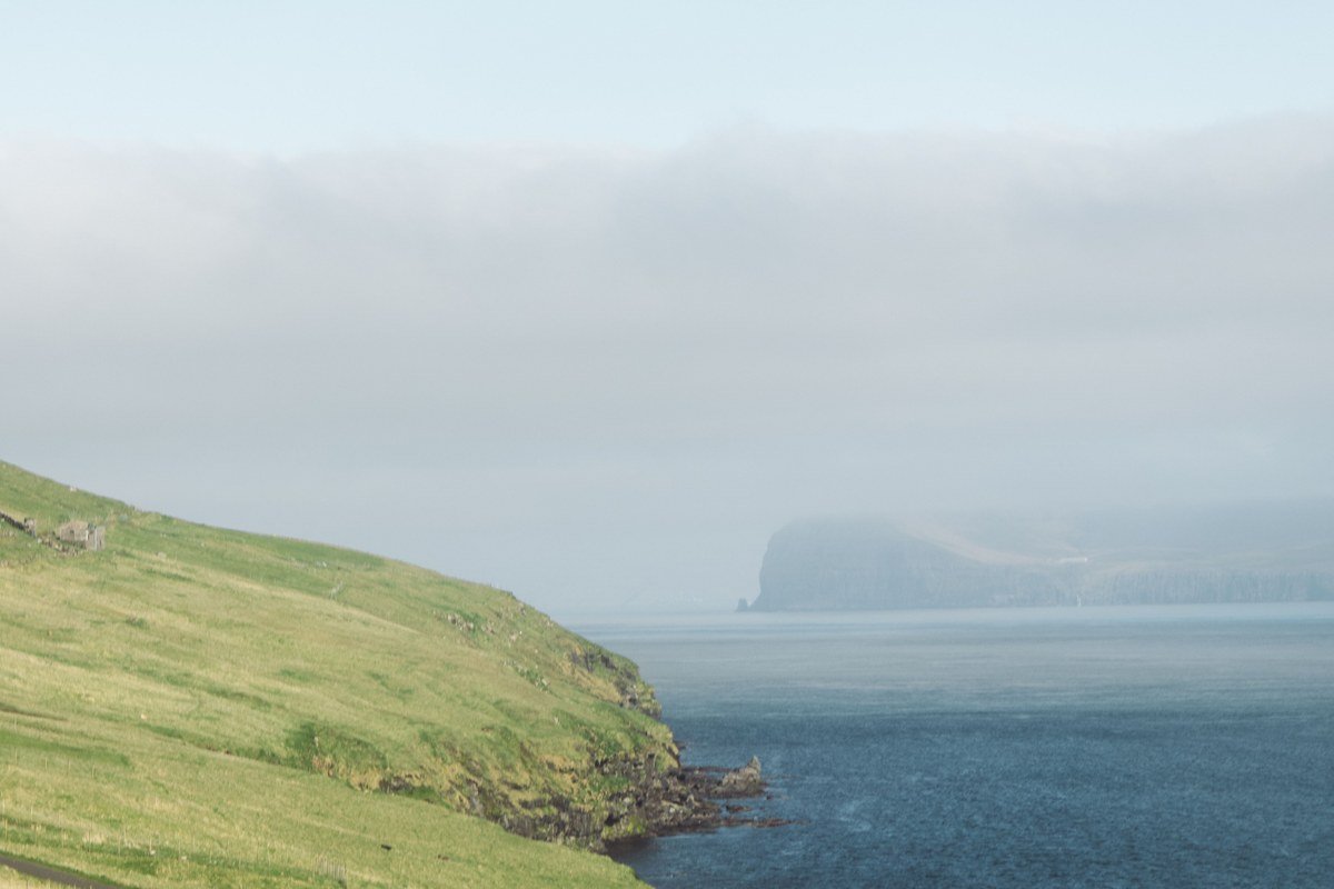 Sorvagsvatn lake Faroe Islands optical illusion cliff above ocean fog