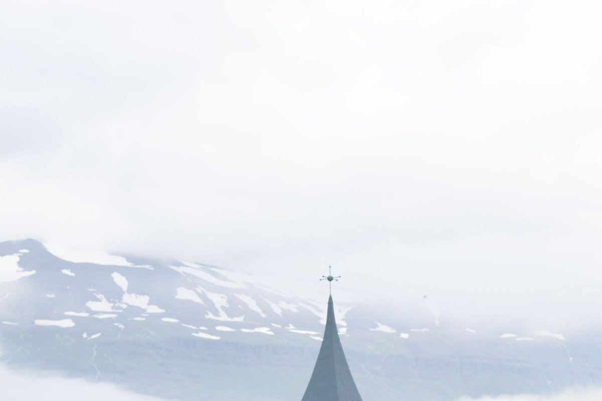 Funningur church Eysturoy Faroe Islands white church fjord mountain fog