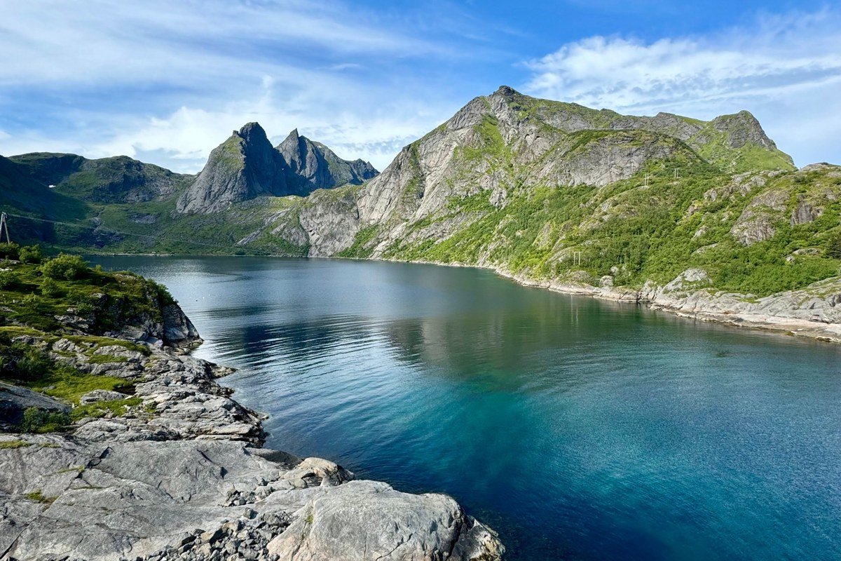 Saebo Norangsfjord Norway sunken village ruins underwater clear water mountains reflection