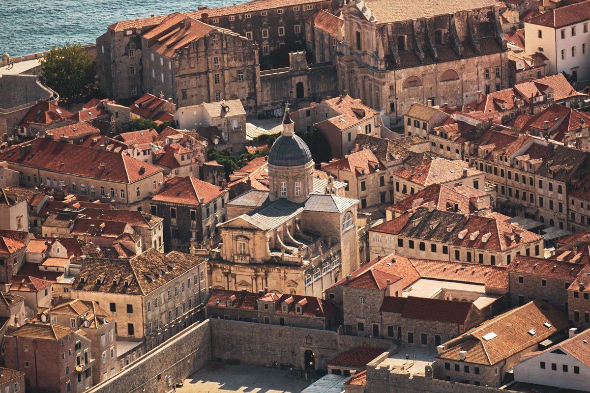 Adriatic Coast blue harbor town whitewashed buildings summer aerial view