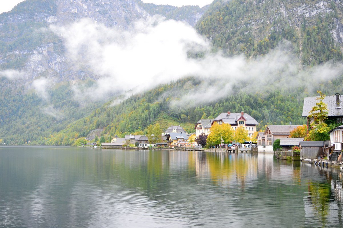 Hallstatt Austria lakeside village misty morning reflection Alps