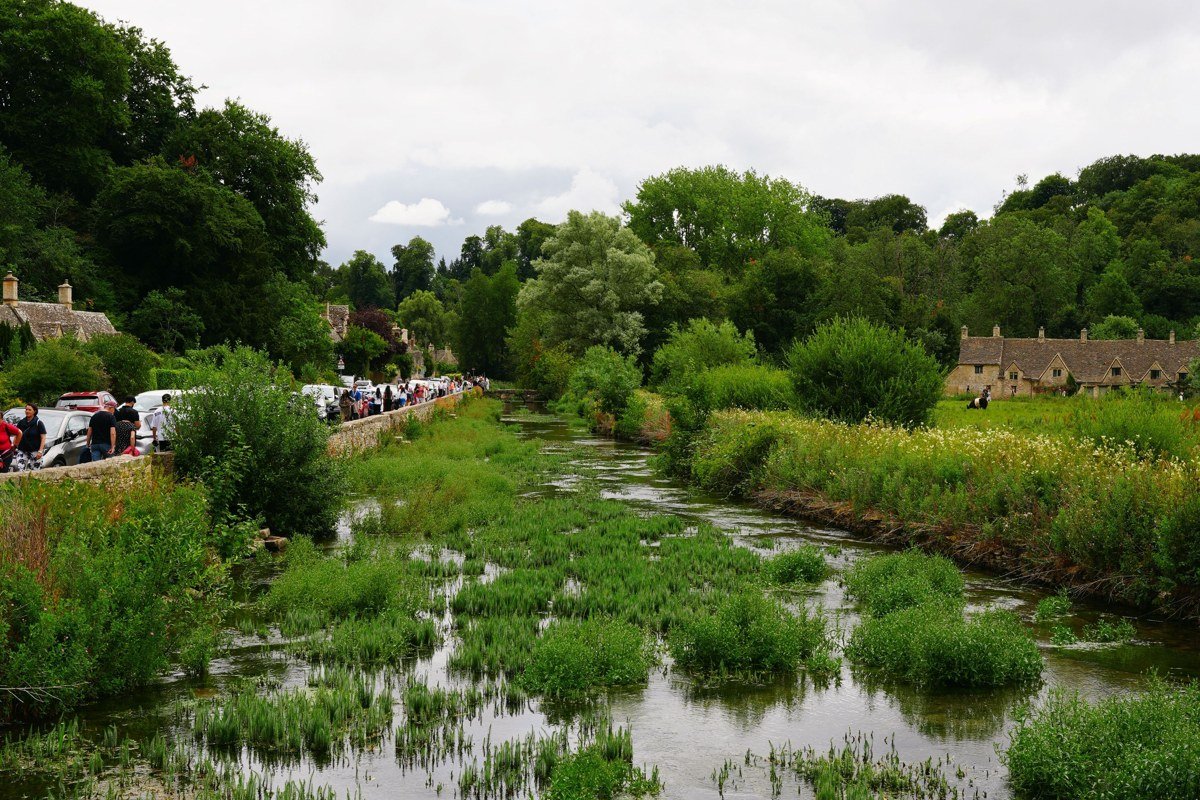 Bibury Cotswolds Arlington Row honey-stone cottages morning mist stream