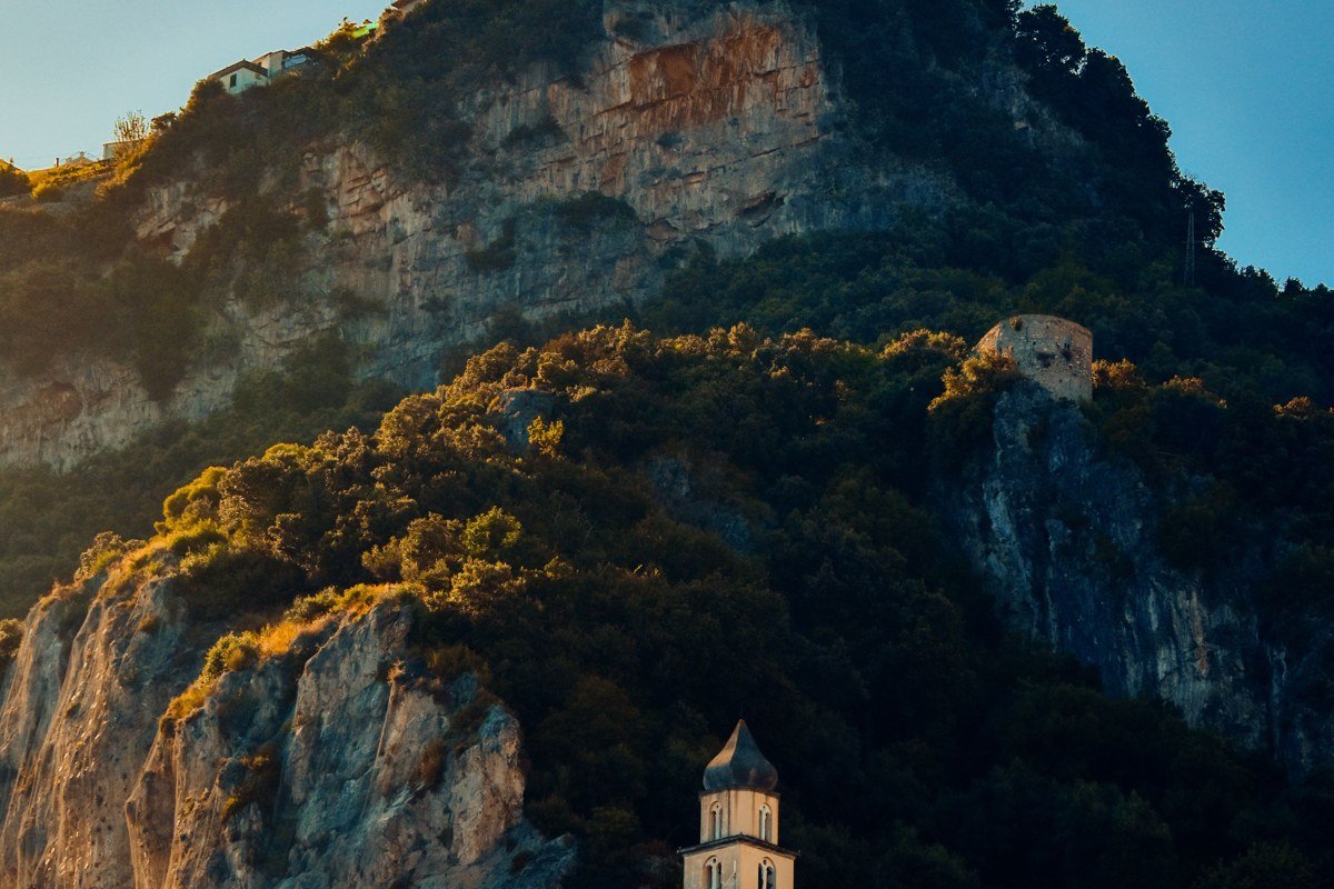 Positano Italy cliffside village pastel houses morning mist Amalfi Coast