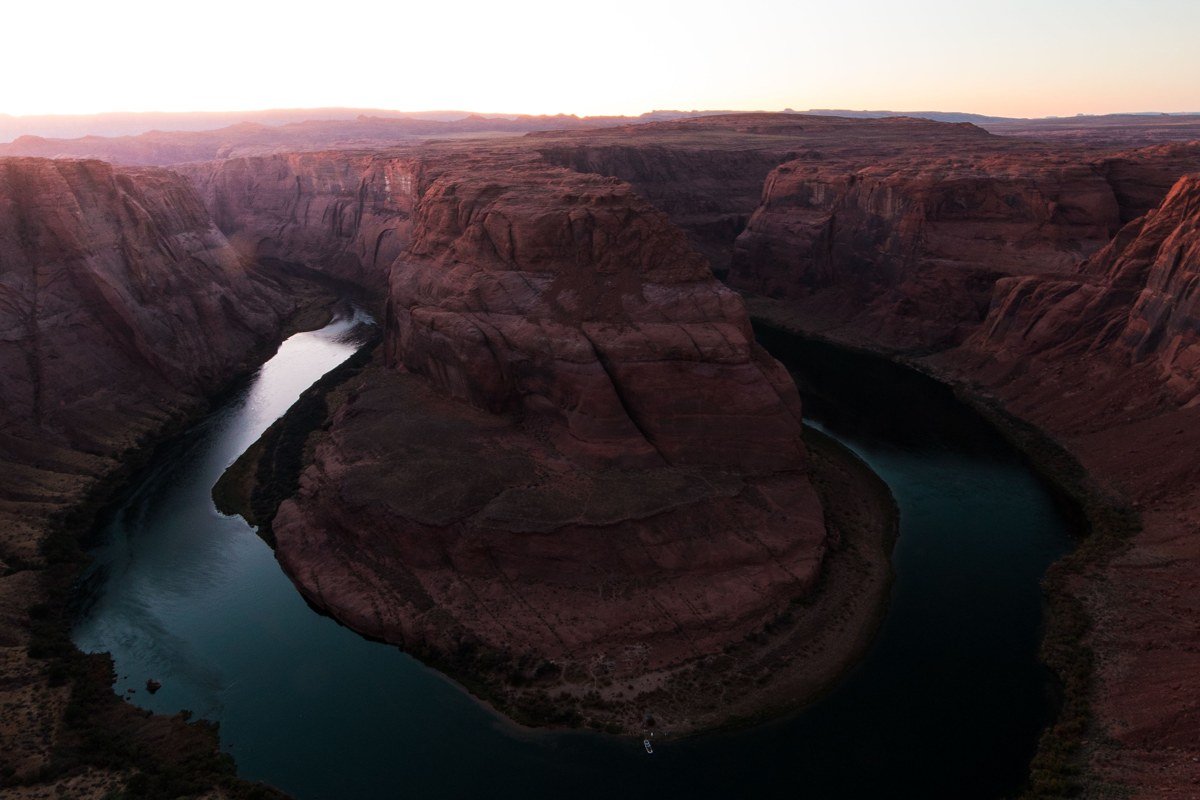 Colorado River Grand Canyon rafting camp red canyon walls sunset Arizona