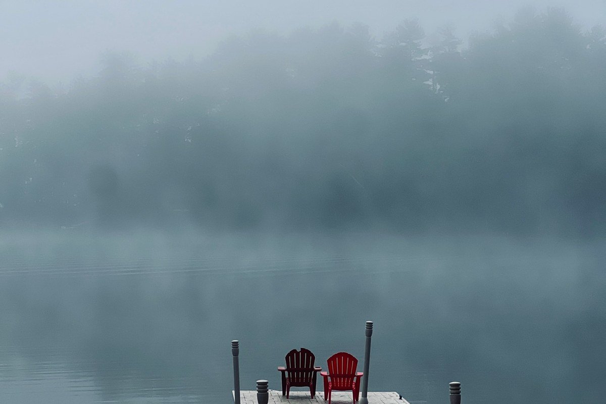 Upper Midwest lake town wooden dock autumn fog misty water birch trees