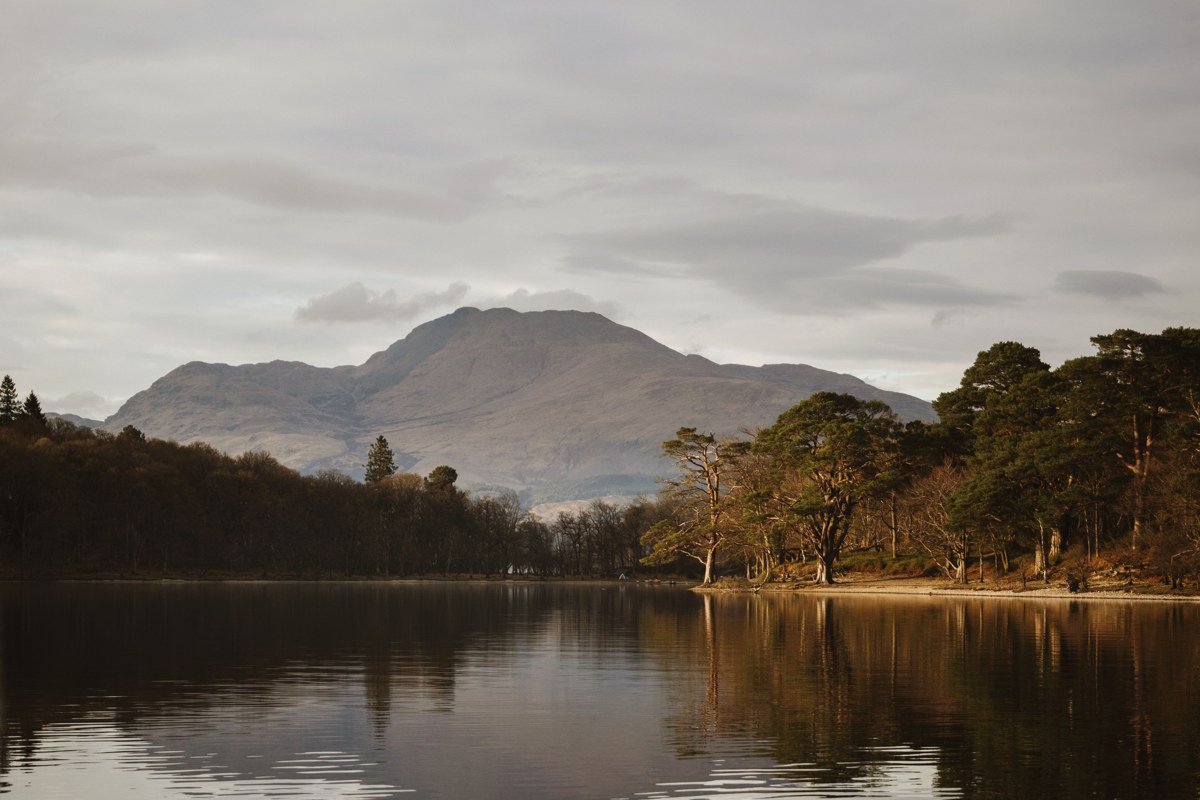 isolated sandstone torpedo of Suilven reflected in still moorland loch, late spring Assynt Sutherland Scotland