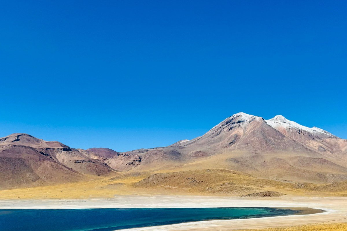 Laguna Colorada Bolivia dry season brick-red water white borax islands James flamingos sunrise altiplano Eduardo Avaroa reserve