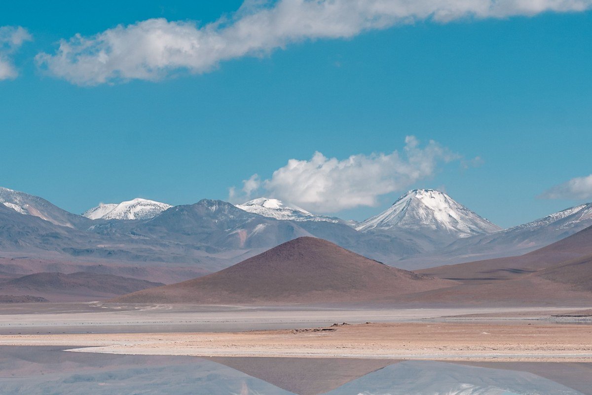 Tunupa volcano Bolivia salt flat north shore Coquesa village pre-Columbian cemetery adobe ruins sunrise aerial perspective dry season