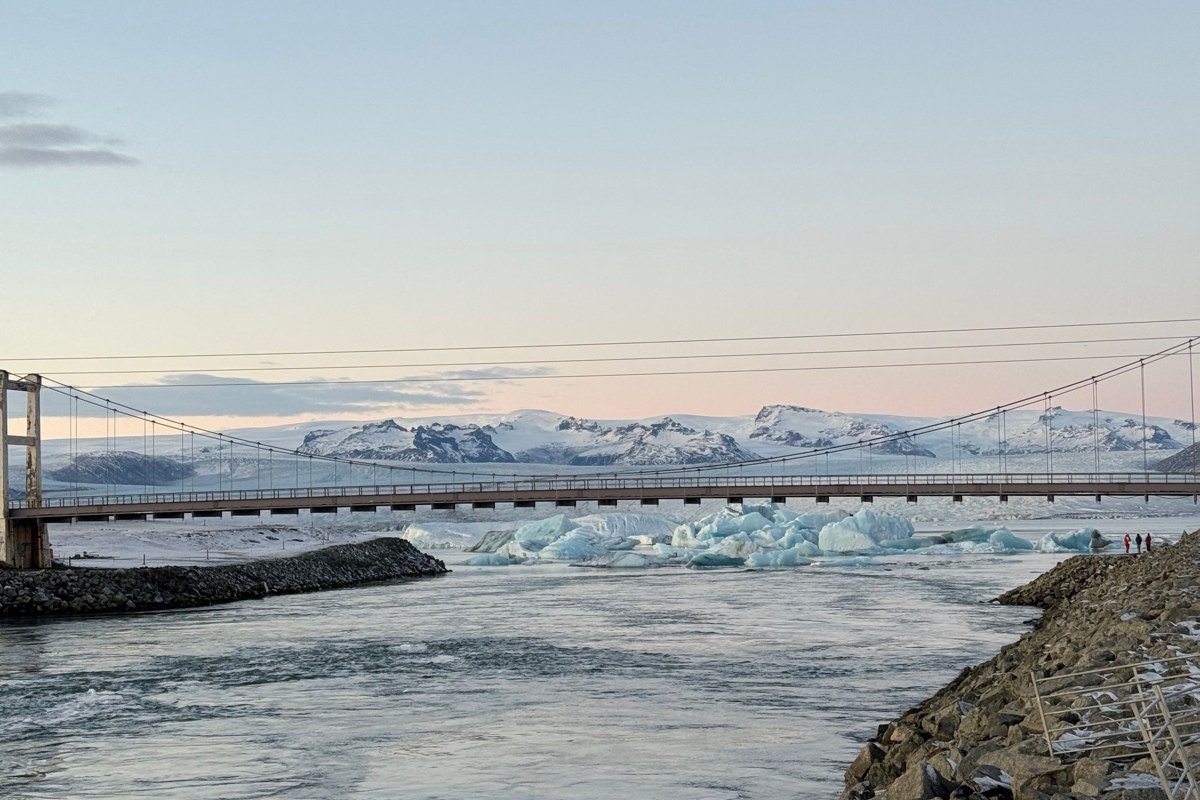 Siglufjordur Iceland colorful harbor village snow-capped mountains reflection