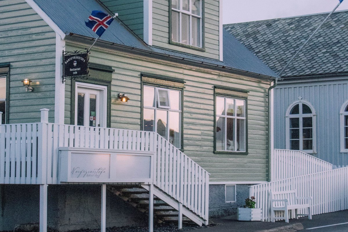 Seydisfjordur Iceland rainbow street church blue wooden houses fjord