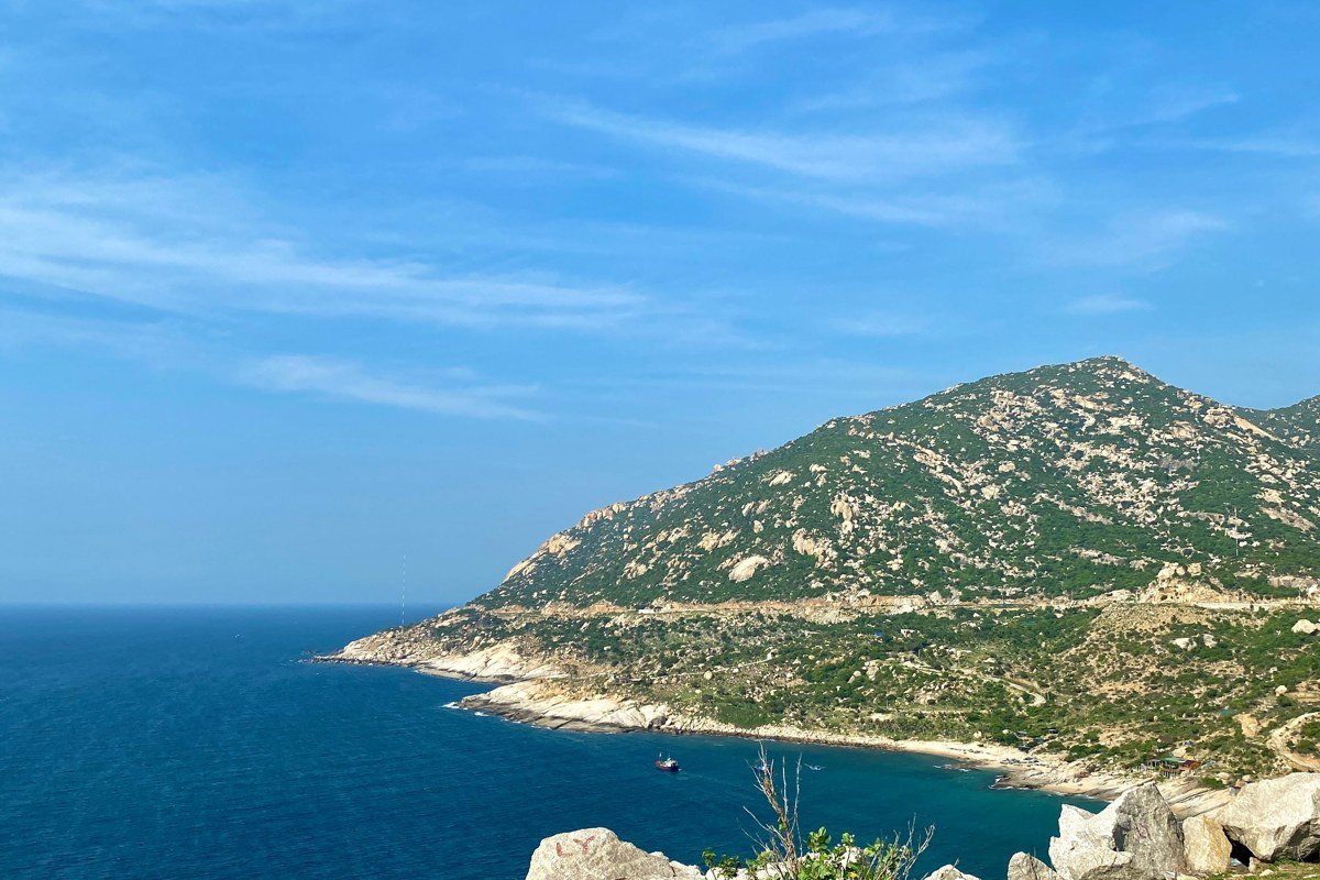 Ikaria island Greece dramatic rocky coastline turquoise water traditional stone village hillside