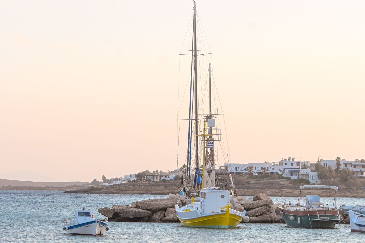 Lipsi island Greece small harbor white chapel blue dome fishing village quiet summer afternoon