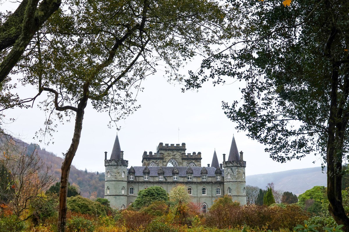 Traquair House Scottish Borders ancient house autumn mist trees ivy stone courtyard