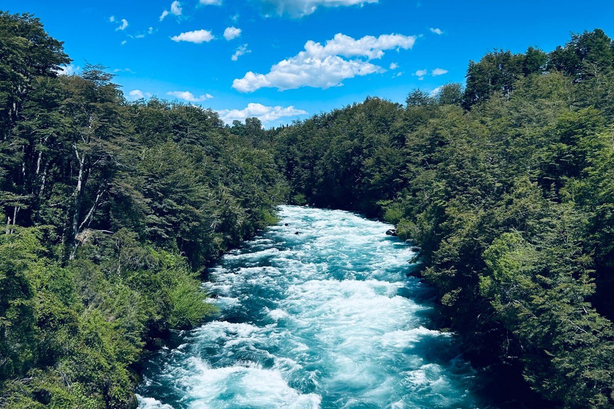 Rio Simpson Coihaique Chile river valley dramatic rain clouds emerald water autumn light