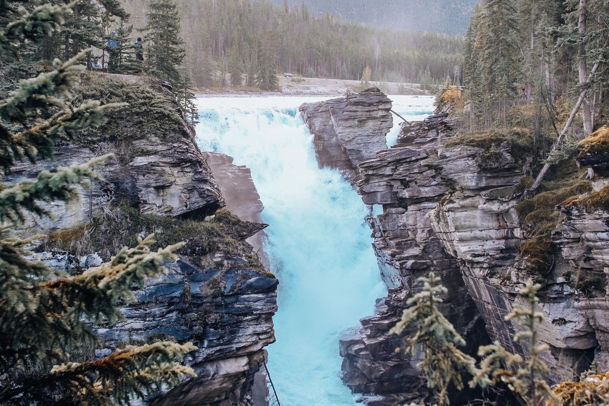 Athabasca River canyon cliff jumping Jasper National Park turquoise water swimmers