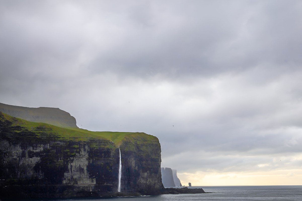 Viðoy island Faroe Islands northern plateau edge sea cliffs remote fog green