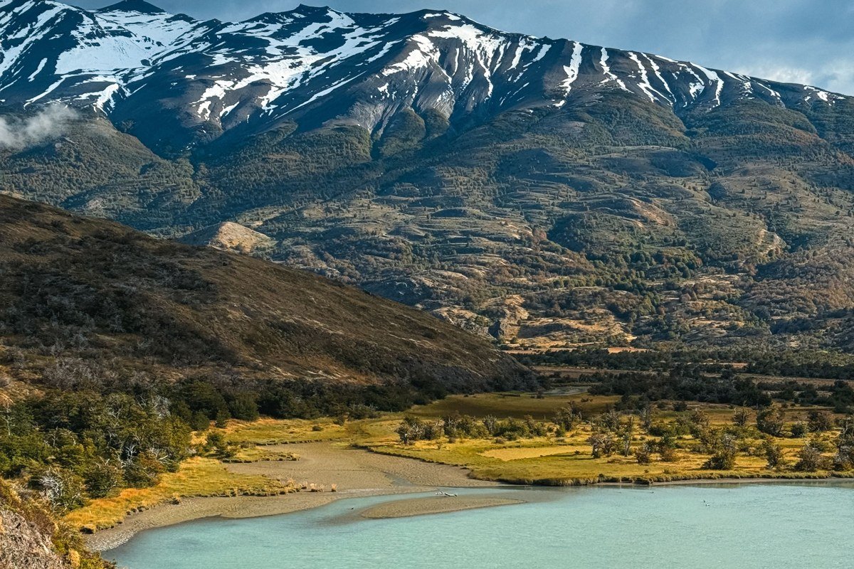 Patagonia Andes dramatic volcanic landscape turquoise lake surreal aerial view