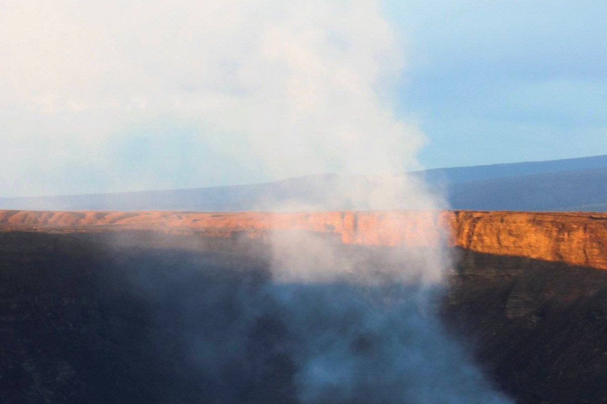 Volcan Villarrica crater rim Chile active volcano lava glow smoke summit dawn