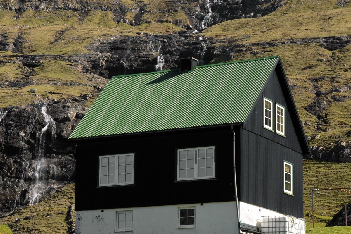 Saksun Faroe Islands turf-roofed village tidal lagoon misty morning