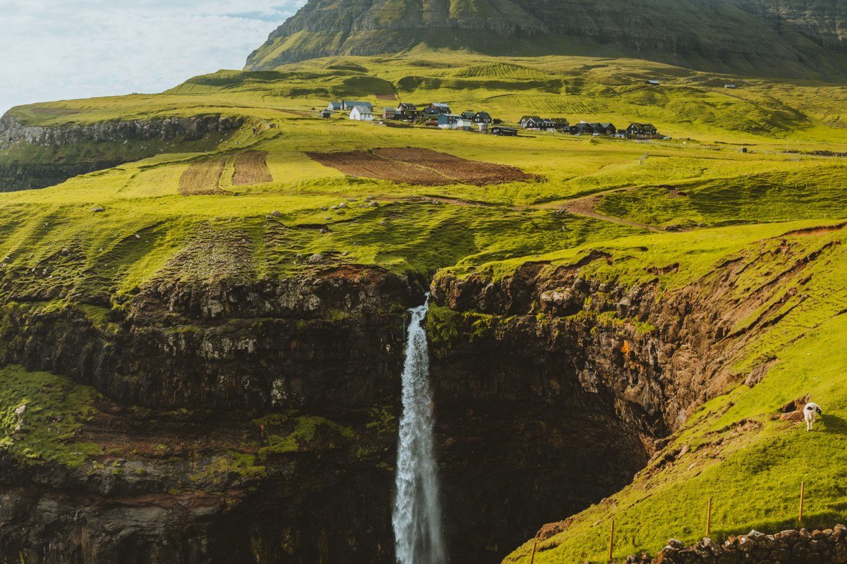 Gasadalur Faroe Islands village waterfall cliffs Atlantic ocean panoramic