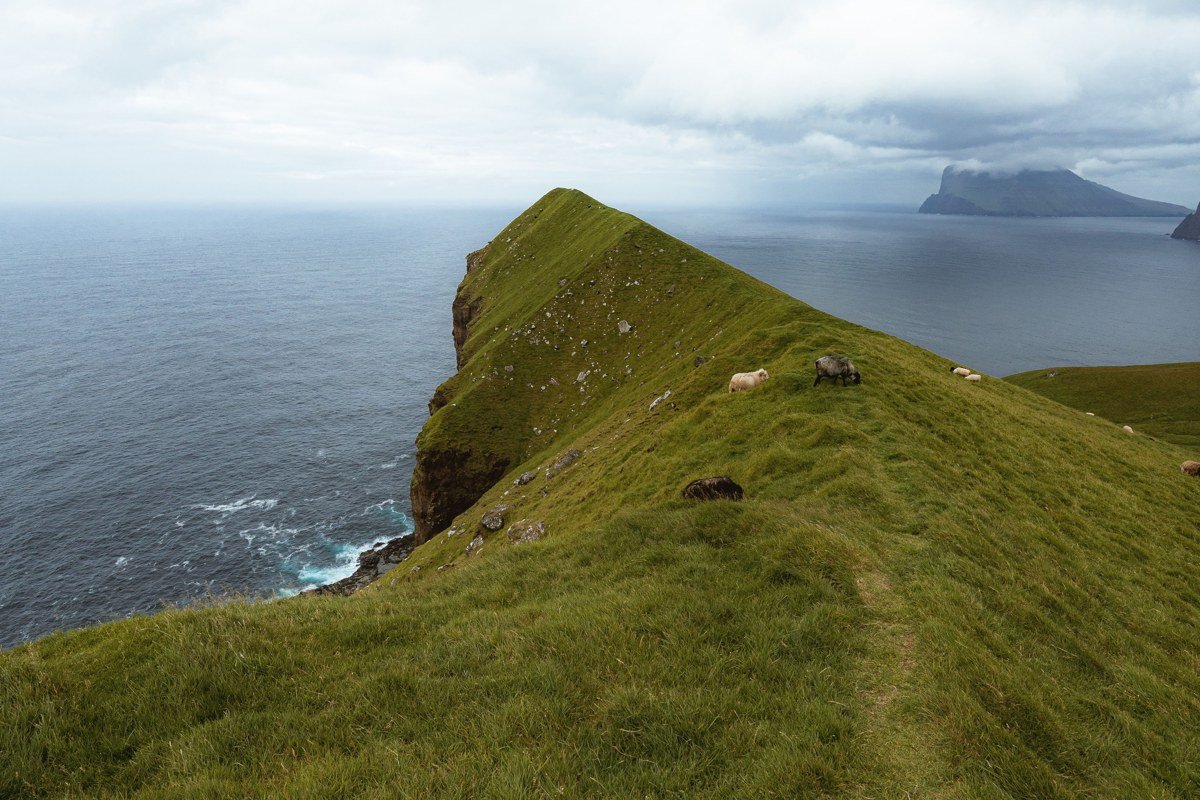 Kallur lighthouse Kalsoy Faroe Islands peninsula narrow ridge dramatic ocean view