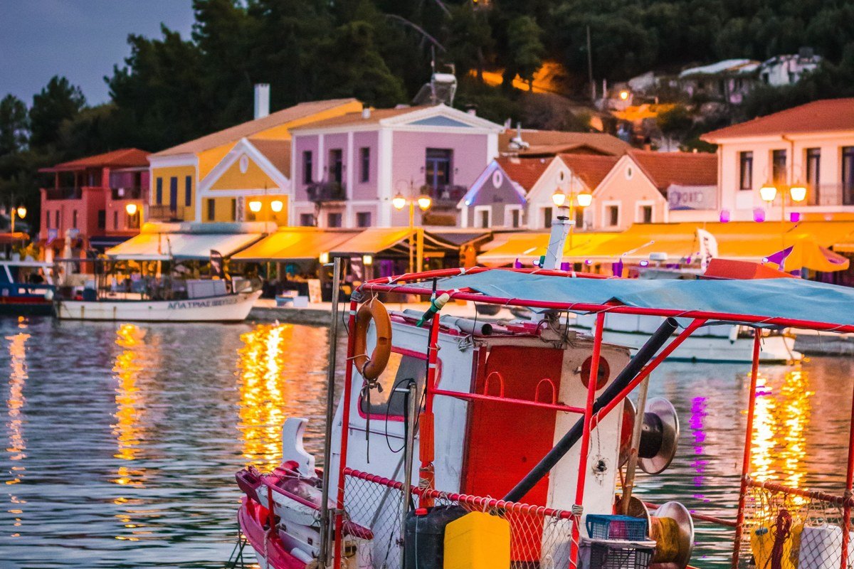 Hora Sfakion Crete small harbor fishing boats evening golden light