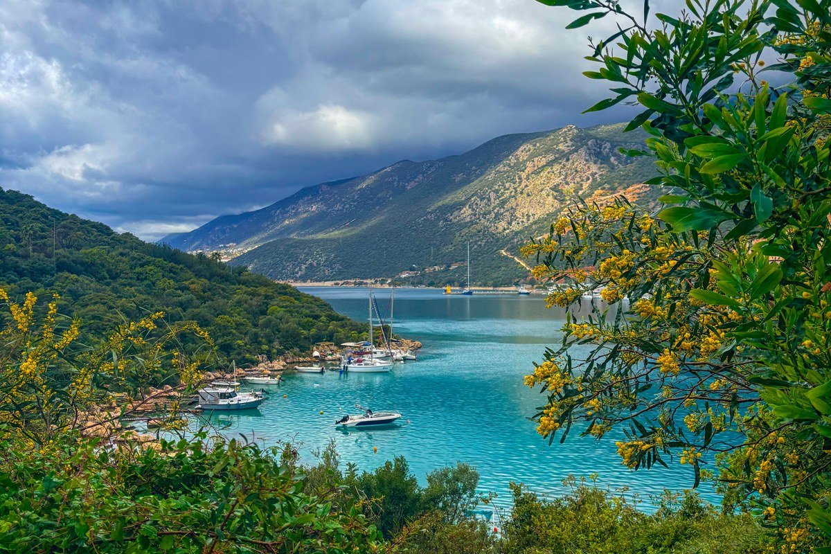 Ithaca Greece Vathy harbour sailboats green hills turquoise water Ionian island