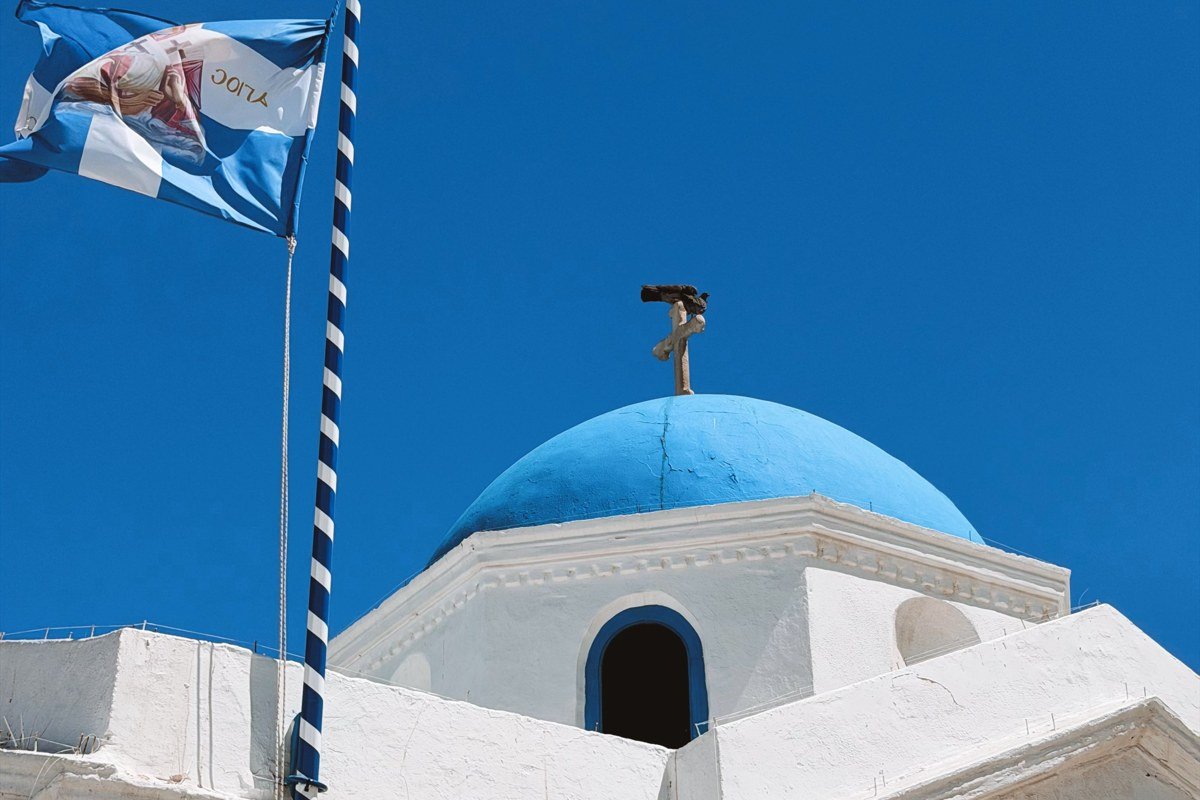 Tilos Greece rocky hillside village terraced fields blue church dome