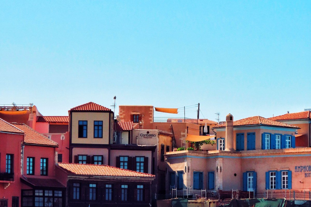 Kastellorizo harbor Greece colorful neoclassical houses sea cave blue grotto
