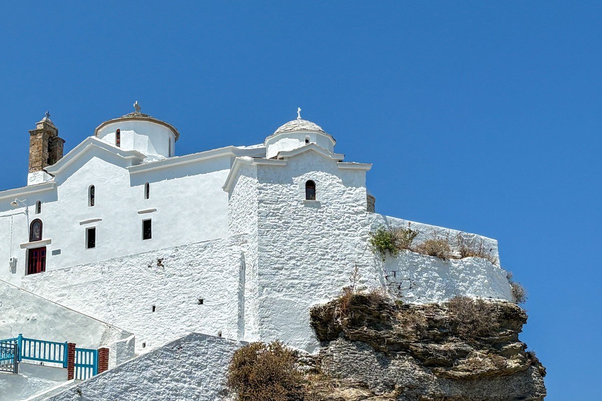 Anafi Greece whitewashed village cliff monastery monolith rock Aegean view