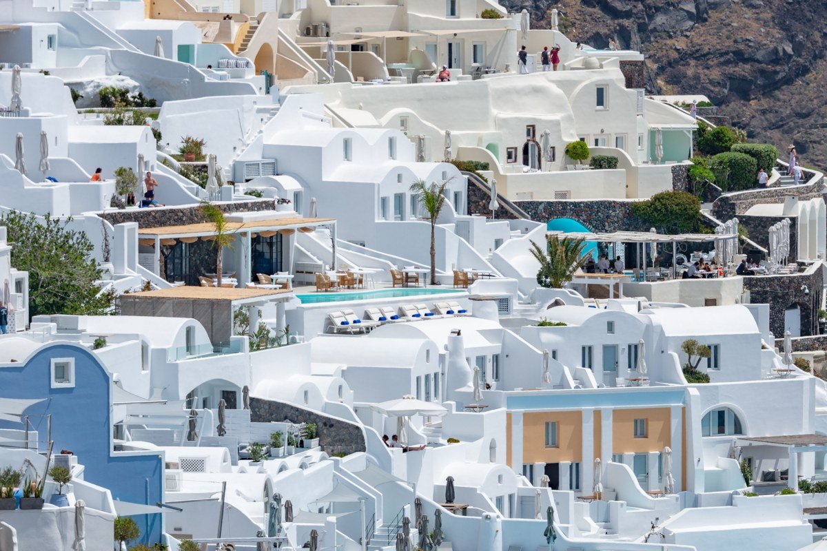 Thirasia island Cyclades whitewashed cliffside village overlooking Santorini caldera Greece