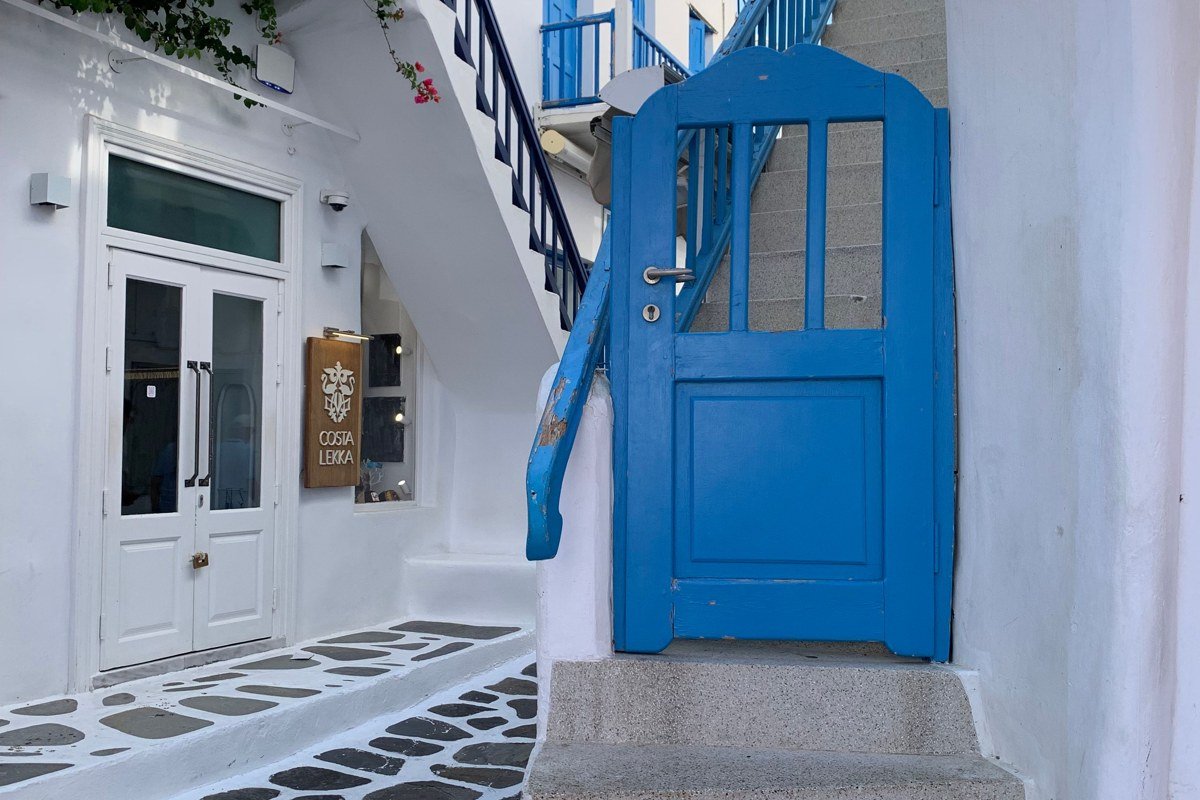 Folegandros Chora whitewashed village clifftop terrace bougainvillea overlooking Aegean Sea