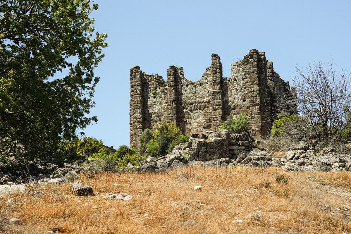 Tilos Greece Megalo Chorio abandoned medieval village hillside wildflowers stone ruins Aegean