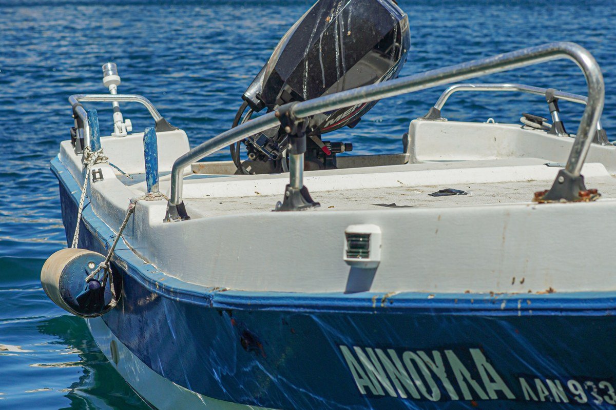 Lipsi island Greece small harbor white blue fishing boats waterfront chapel bougainvillea