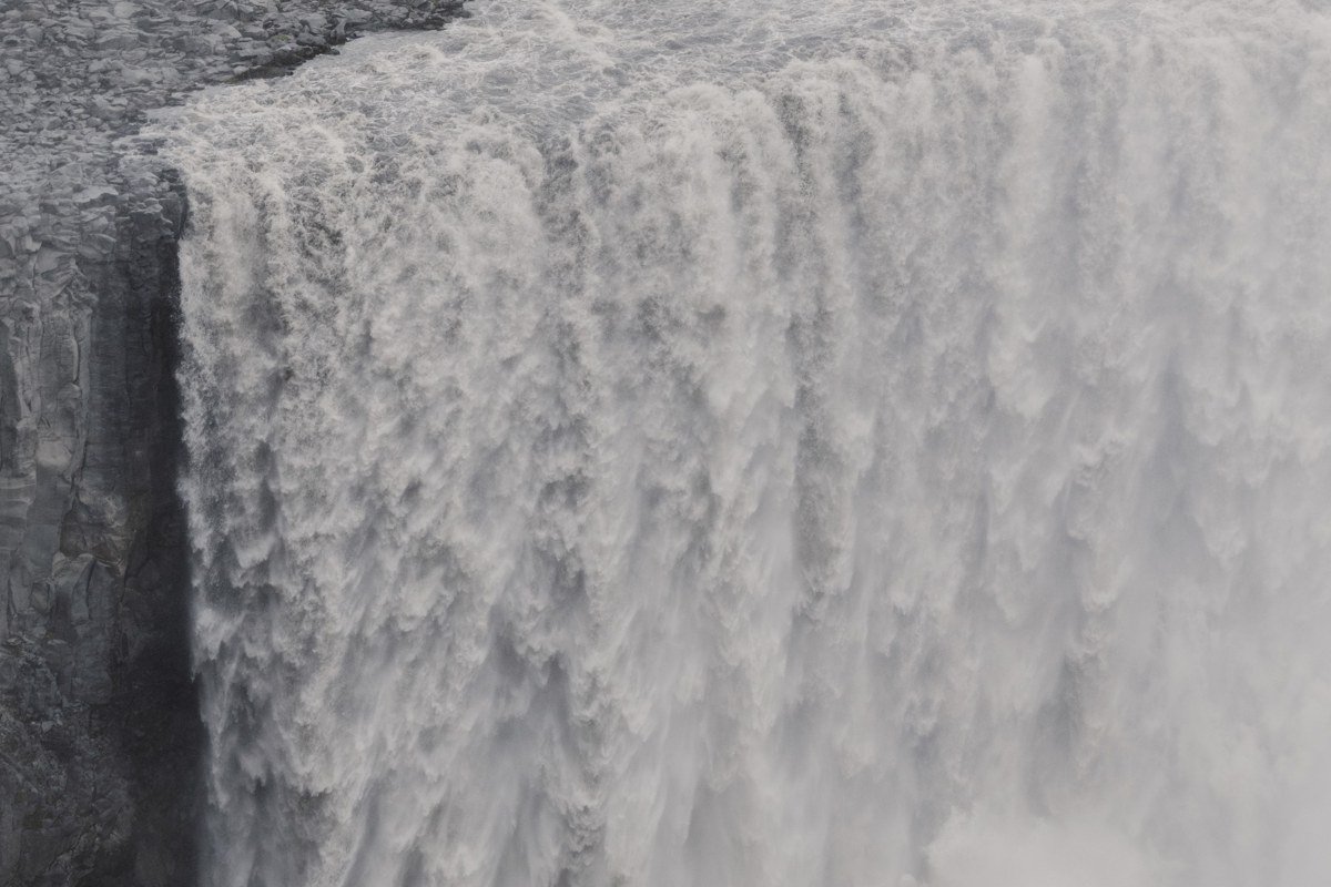 Dettifoss waterfall Iceland mist and power spray canyon volcanic rock