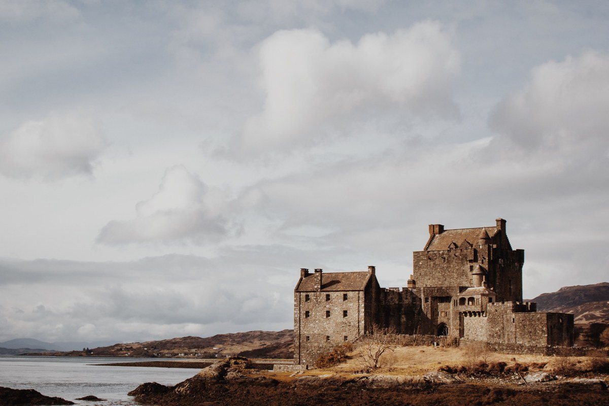 Eilean Donan Castle Scotland winter mist reflection in Loch Duich