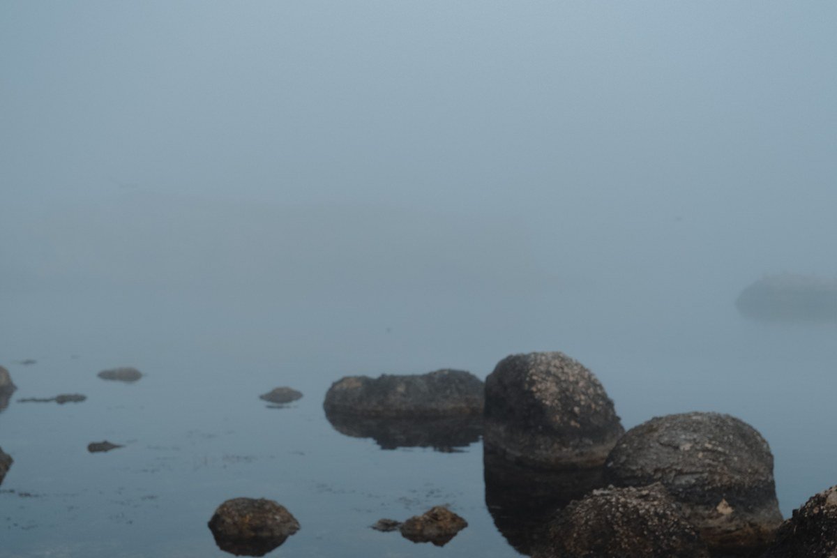 Drumbeg village Assynt Scotland harbour loch stack rocks mist morning