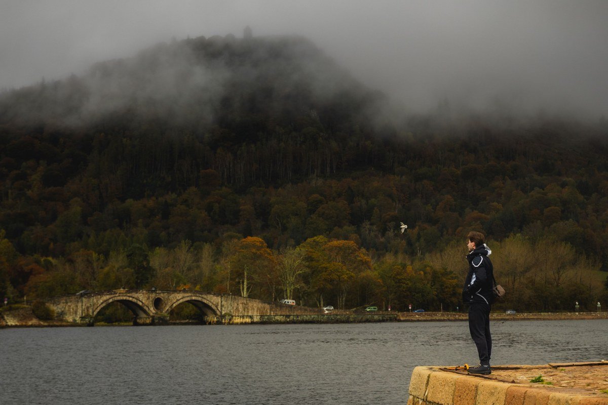Dornie village Eilean Donan Castle Scotland loch reflection misty morning autumn